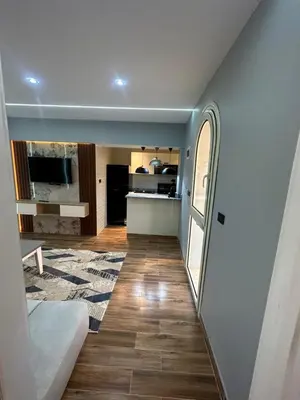 a living room and kitchen in a house at Mashrabiya one bed room apartment in Hurghada