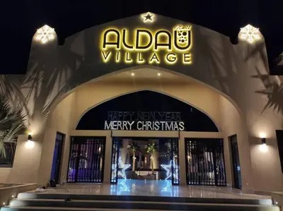a store front with a sign that reads adidas village at Family apartment Aldau Heights in Hurghada