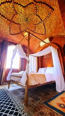 a bedroom with a canopy bed in a room at Luxor Tower in Luxor