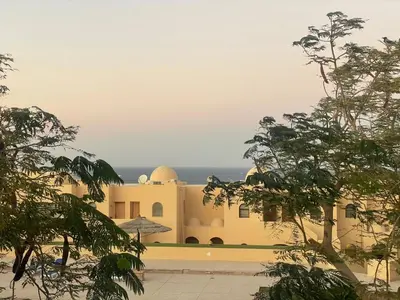 a building with trees in front of it at The view in Hurghada