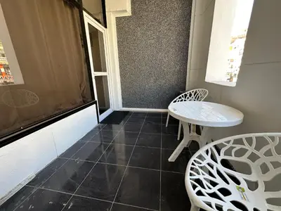 a small room with two chairs and a table at Falcon Loft Studio Sheraton Road in Hurghada