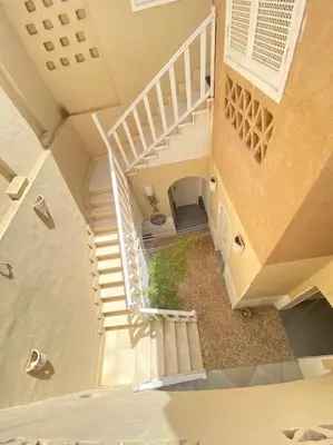 an overhead view of a staircase in a house at HF - residency in Luxor
