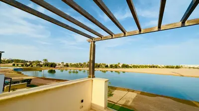 a view from the balcony of a house with a swimming pool at Ollystays 4BR Villa Heated Pool El Gouna in Hurghada