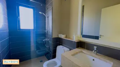 a bathroom with a tub and a toilet and a sink at Tawila 4BR Villa Private Pool in Hurghada