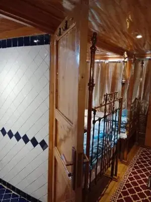 a door in a room with a tiled wall at Nubian Sandal in Aswan
