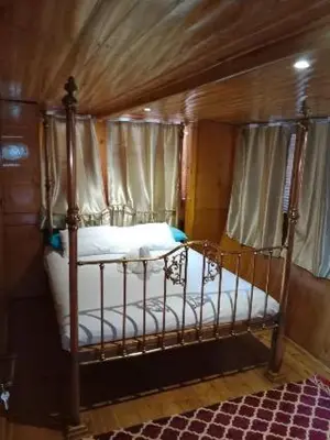 a bedroom with a canopy bed in a room at Nubian Sandal in Aswan