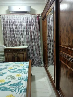 a bedroom with a bed and a window with a curtain at Appartment in Hurghada in Hurghada