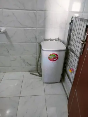 a bathroom with a trash can in the corner at Tyba view in Hurghada