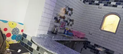 a kitchen with a sink and a counter top at Rozan Guest house Aswan in Jazīrat Aswān