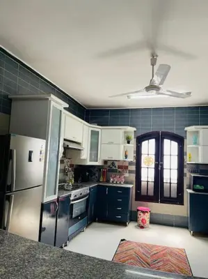 a kitchen with blue and white appliances and a ceiling at Mado luxury villa with private pool in Luxor