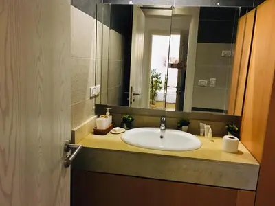 a bathroom with a sink and a mirror at Fanadir Bay in Hurghada