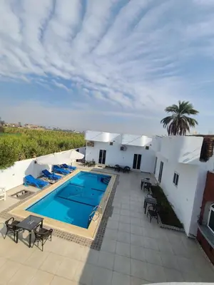 a villa with a swimming pool and a resort at Luxor Sapphire in Luxor