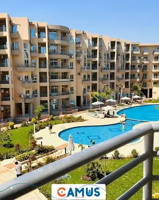 a view of a large apartment complex with a swimming pool at CAMUS 117 B, Princess Resort in Hurghada