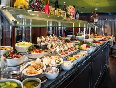 a buffet line with many plates of food on it at Nile Cruise FB 3 Nights Aswan Luxor in Aswan