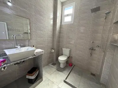 a bathroom with a toilet and a sink and a shower at Sylvie guest house I in Luxor