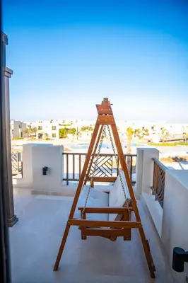 a wooden ladder sitting on top of a balcony at 4 Bedrooms, Luxury Villa Makadi Heights in Hurghada