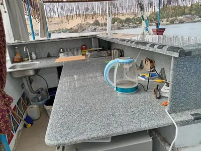 a kitchen counter with a jug on top of it at Nile Bride in Aswan