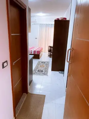 an open door to a room with a bedroom at Tiba A F B View in Hurghada