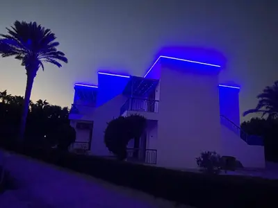 a building with blue lights on it at night at Mirage Bay Resort & Aqua park, Hurghada in Hurghada