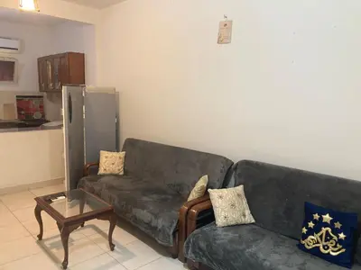 a living room with a couch and a coffee table at M-2bedroom flat with garden in Hurghada