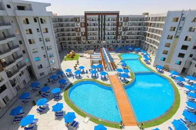an aerial view of an apartment complex with a swimming pool at Tiba Golden Resort one bedroom in Hurghada