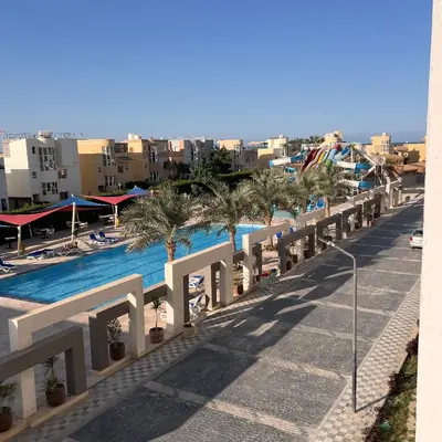 a view of the pool from the balcony of a resort at Modern Retreat with Red Sea View - Fanadir bay in Hurghada