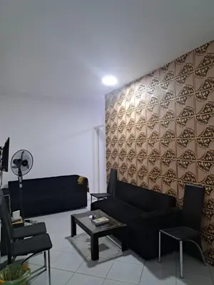 a living room with a couch and a table at Desert Bearl compound in Hurghada