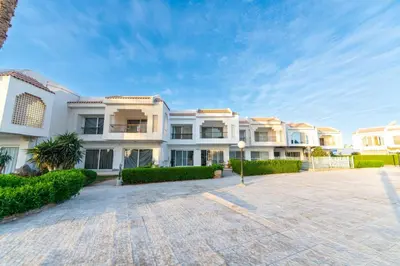 an exterior view of a large white building at Hurghada Khaligeya village in Hurghada