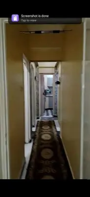 a hallway in a building with a long corridor at Aswan Lovely Apartment in Aswan