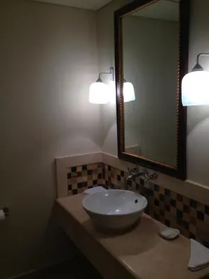 a bathroom with a sink and a mirror at Cozy studio with a view in port ghalib in Marsa Alam