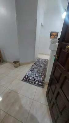 a room with a door and a tile floor at Blue Lotus House in Luxor