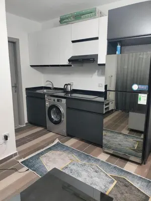 a kitchen with a washing machine in a room at Porto Ghalib in Port Ghalib