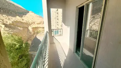 a balcony with a view of a mountain at Andalusia Palace in Hurghada