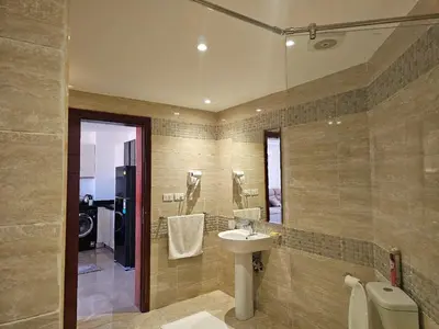 a bathroom with a sink and a mirror at Elhambra First Avenue in Hurghada