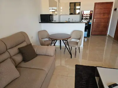 a living room with a couch and a table at Elhambra First Avenue in Hurghada