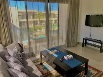 a living room with a couch and a table at Stunning 1-Bedroom in G Cribs in Hurghada