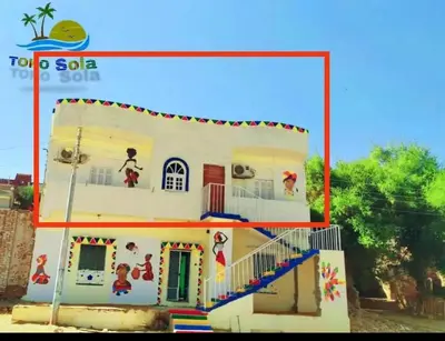 a house that is painted like a play house at Toko Sola in Jazīrat Suhayl