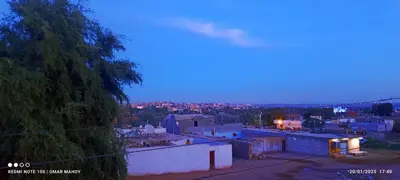 a view of a city at night at Toko Sola in Jazīrat Suhayl