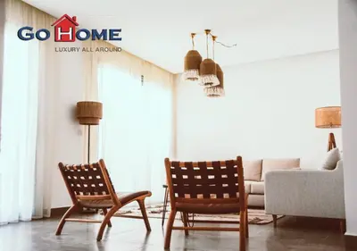 a living room with two chairs and a couch at Cozy 3BR at Sholan with Private Heated Pool El-Gouna in Hurghada