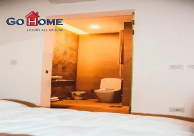 a room with a bathroom with a toilet and a bed at Cozy 3BR at Sholan with Private Heated Pool El-Gouna in Hurghada