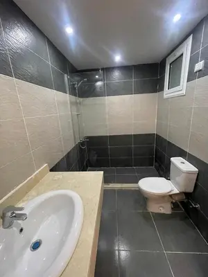a bathroom with a sink and a toilet at Fanadir Bay Compound in Hurghada
