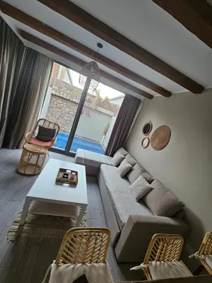 a living room with a couch and a table at one bedroom in gouna in Hurghada