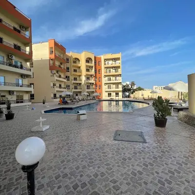 a courtyard with a swimming pool in a building at 1 plus 1 in city centre Hurghada in Hurghada