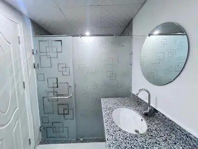 a bathroom with a sink and a shower with a mirror at Scandic Hotel Hurghada in Hurghada