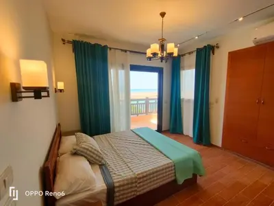 a bedroom with a bed with a view of the ocean at Luxury 2 bedroom in fandir el gouna in Hurghada
