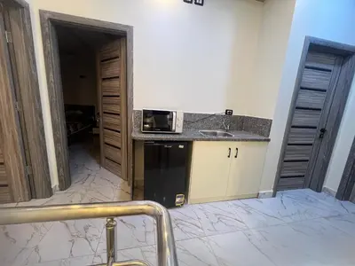 a kitchen with a sink and a microwave at Sky star 135 in Hurghada