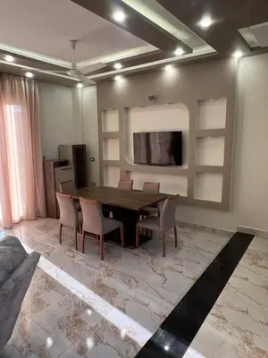 a dining room with a table and chairs at Sky star 135 in Hurghada