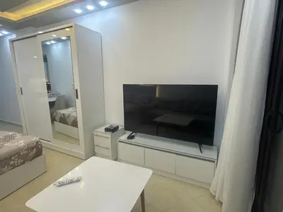 a living room with a large flat screen tv at Al Saraya Sahl Hashish Serenity Chalet in Hurghada