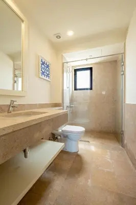 a bathroom with a toilet and a sink at Fanadir 3BR • Prime Sea View Villa in Hurghada