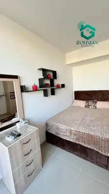 a bedroom with a bed and a dresser and a mirror at Cozy studio G-cribs in Hurghada